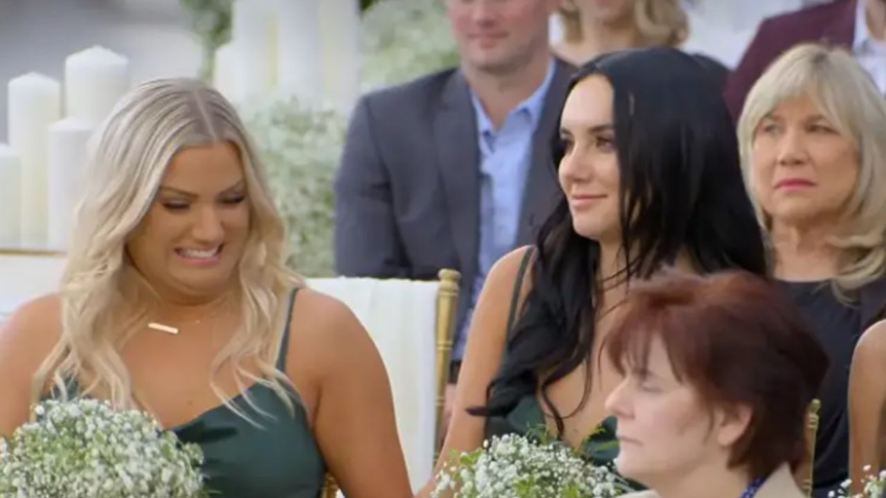 Micah Lussier's bridesmaid, Shelby, smiling after Paul Peden breaks the wedding.